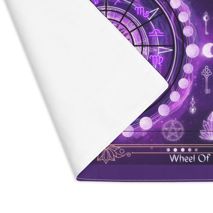 Purple mat with zodiac symbols and 'Wheel of' text on a white background